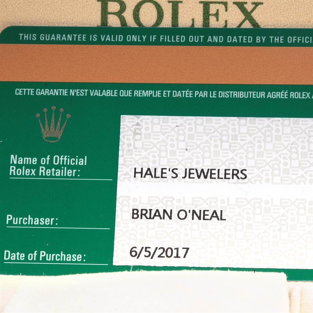This image shows the guarantee card of a Rolex Oyster Perpetual 114200 Men's Stainless Steel Blue Dial 114200 Men's Stainless Steel Blue Dial watch, detailing purchase information.