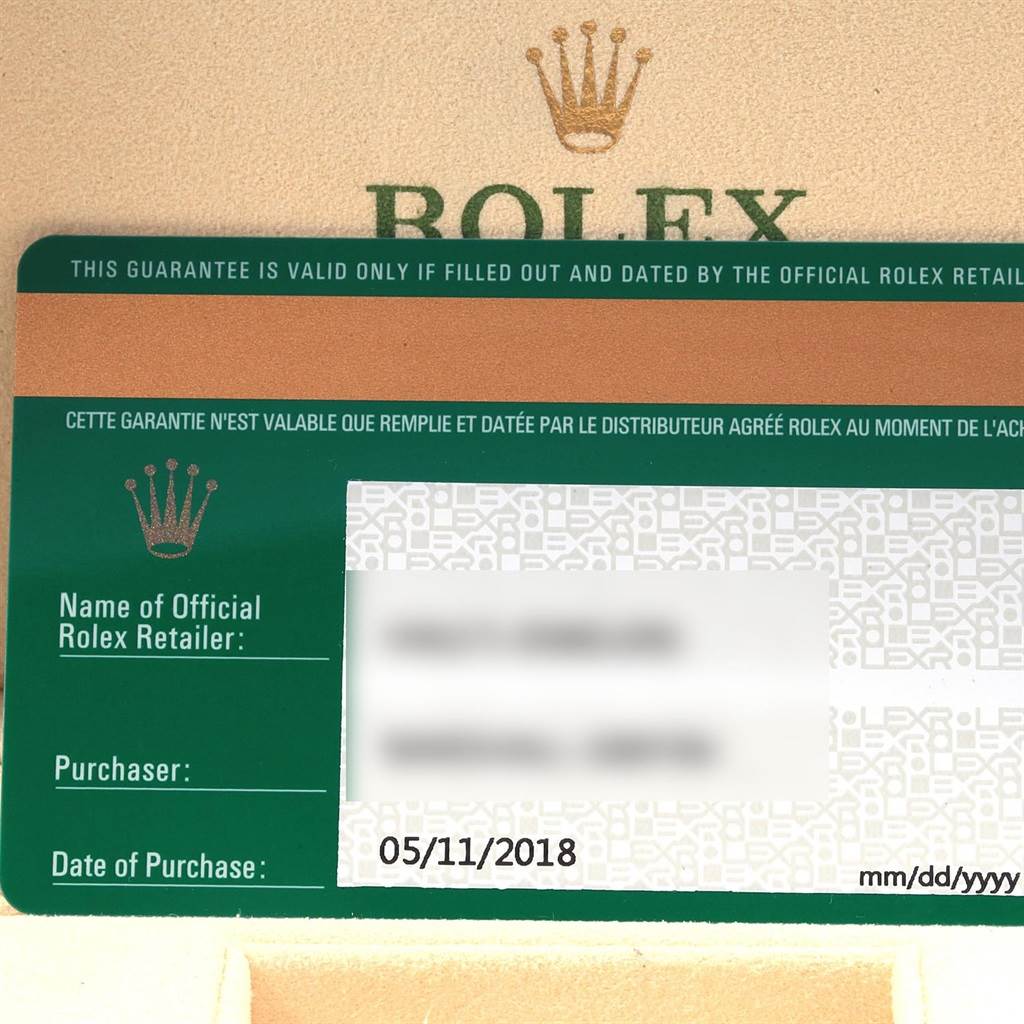The image shows a Rolex warranty card for an Oyster Perpetual watch, displaying the purchase date and retailer details.