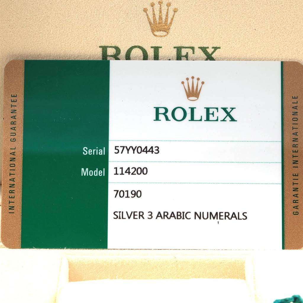 The image shows a warranty card for the Rolex Oyster Perpetual 114200 Men's Stainless Steel Silver Dial 114200 Men's Stainless Steel Silver Dial model 114200.