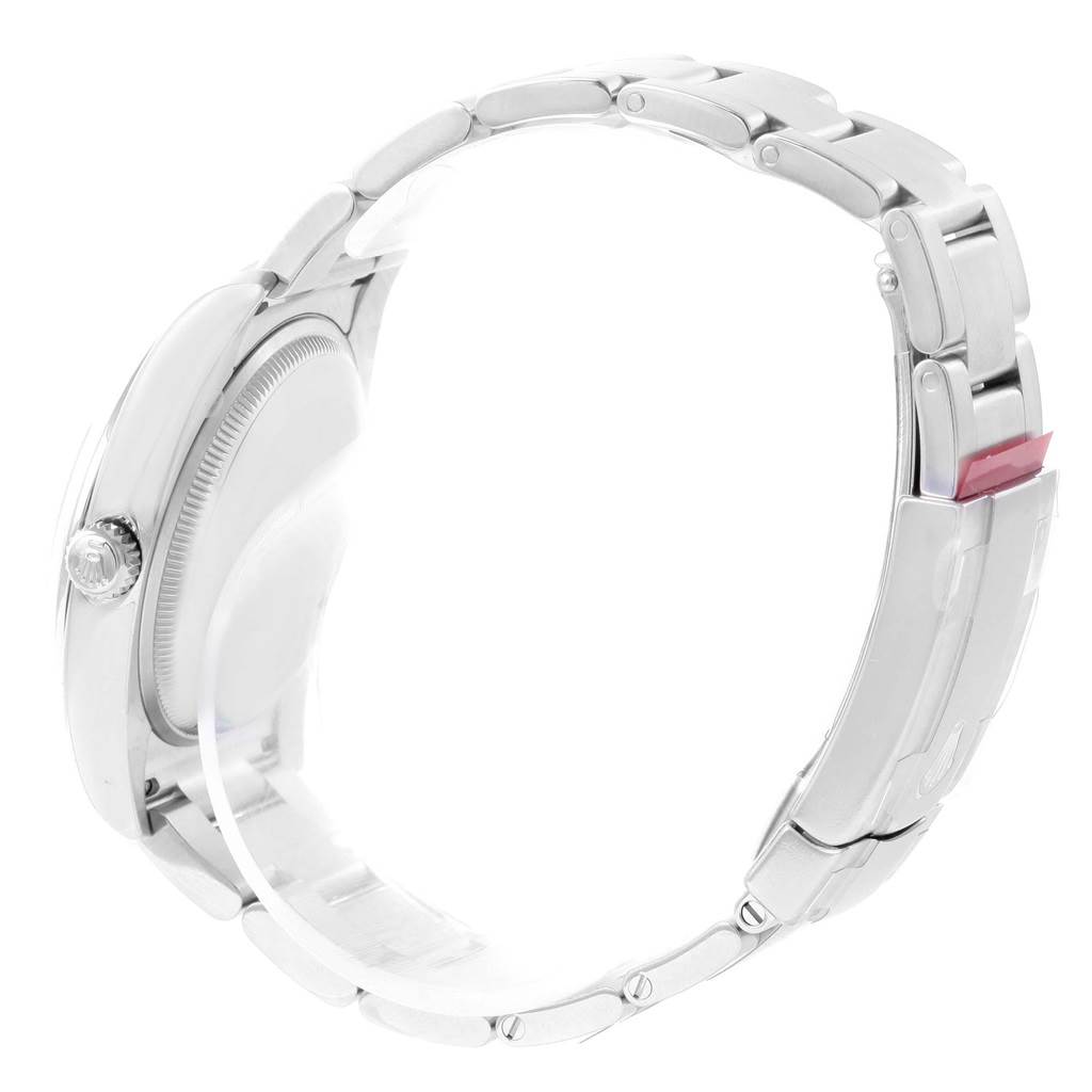 The image shows a Rolex Oyster Perpetual 114200 Men's Stainless Steel Silver Dial 114200 Men's Stainless Steel Silver Dial watch from a side angle, highlighting the case, band, and winding crown.