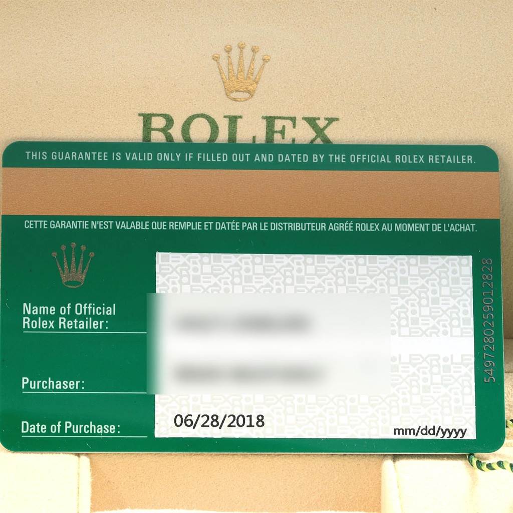 This image shows the guarantee card of a Rolex Oyster Perpetual 114200 Men's Stainless Steel Green Dial 114200 Men's Stainless Steel Green Dial watch, with purchase details visible.