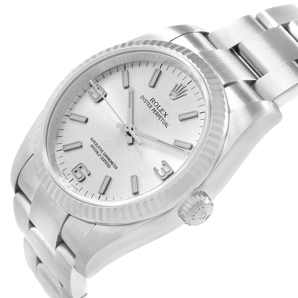 The image shows a close-up angled view of the Rolex Oyster Perpetual 116034 Men's Stainless Steel Silver Dial 116034 Men's Stainless Steel Silver Dial watch, displaying its face, bezel, crown, and part of the bracelet.