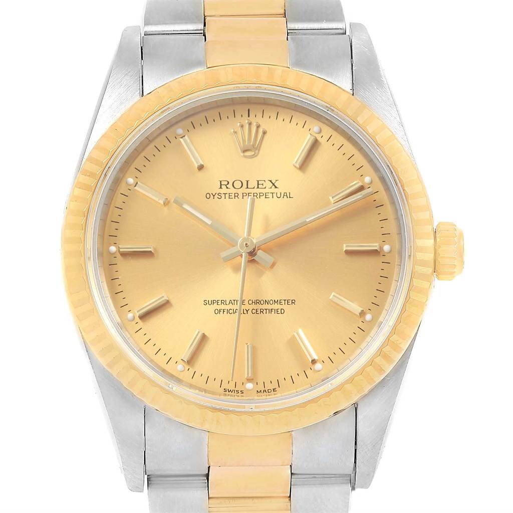 This image shows a front view of a Rolex Oyster Perpetual 14233 Men's Steel and Gold (two tone) Champagne Dial 14233 Men's Steel and Gold (two tone) Champagne Dial watch, highlighting its gold dial, bezel, and two-tone bracelet.