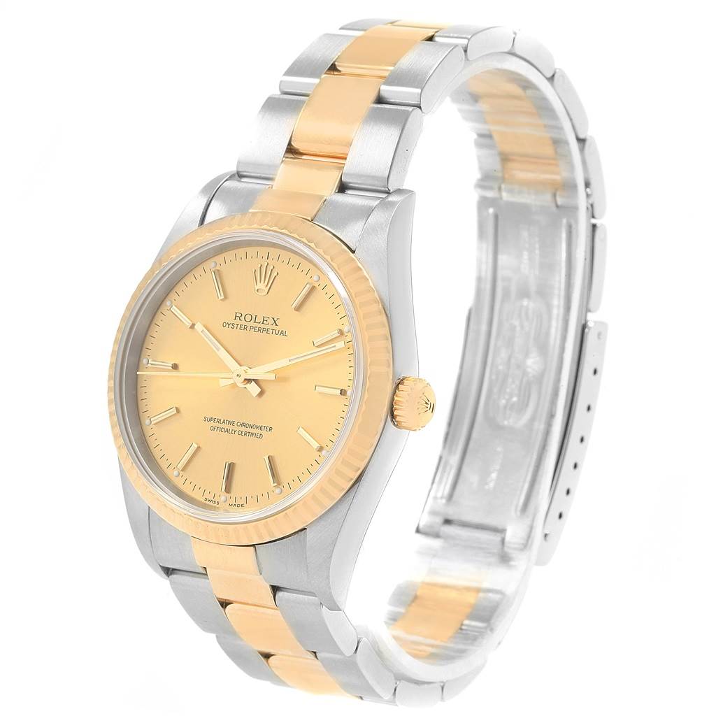 The image shows a Rolex Oyster Perpetual 14233 Men's Steel and Gold (two tone) Champagne Dial 14233 Men's Steel and Gold (two tone) Champagne Dial watch at a slight angle, highlighting the face, bezel, crown, and bracelet.