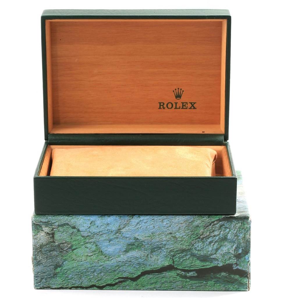 The image shows an open Rolex Oyster Perpetual 14233 Men's Steel and Gold (two tone) Champagne Dial 14233 Men's Steel and Gold (two tone) Champagne Dial watch box with the lid up, revealing an inner cushioned compartment.