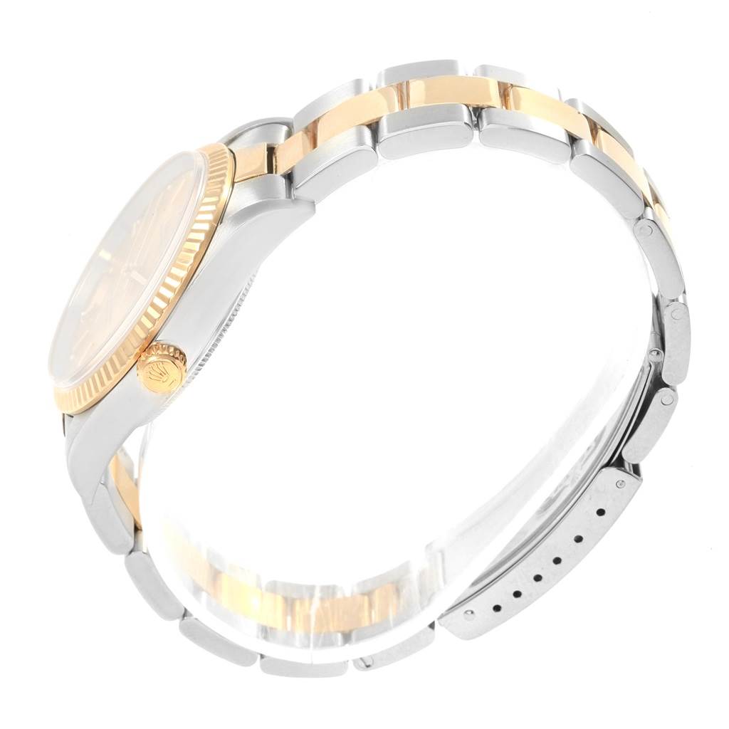 The image shows a side view of a Rolex Oyster Perpetual 14233 Men's Steel and Gold (two tone) Champagne Dial 14233 Men's Steel and Gold (two tone) Champagne Dial watch, focusing on the bracelet, crown, and part of the case.