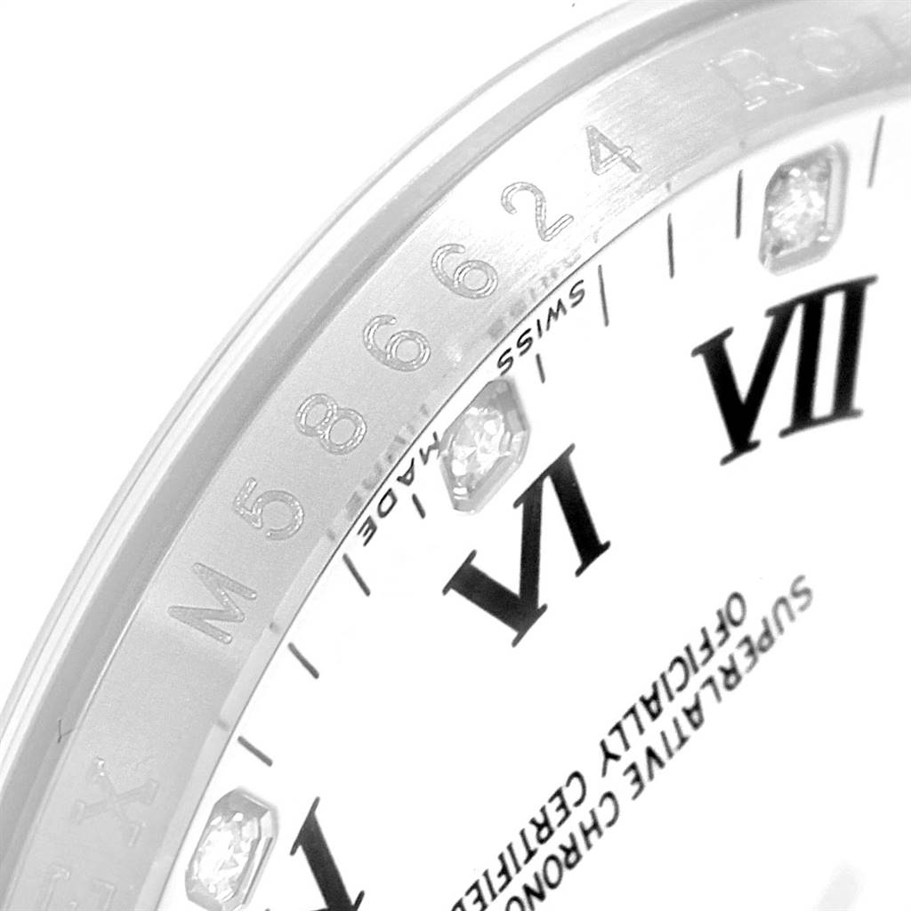 This image shows a close-up of the dial and bezel of a Rolex Oyster Perpetual 116034 Men's Stainless Steel White Dial 116034 Men's Stainless Steel White Dial watch, highlighting the Roman numerals and diamond markers.