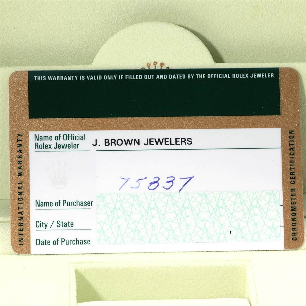 The image shows a warranty card for an Oyster Perpetual model by Rolex, depicting the jeweler
s information and a serial number.