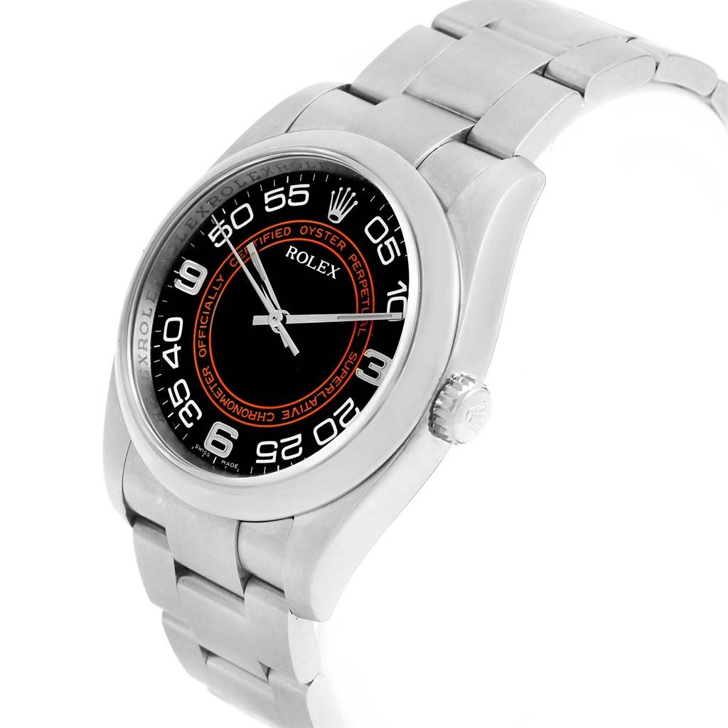 The image shows a Rolex Oyster Perpetual 116000 Men
s Stainless Steel Black Dial 116000 Men
s Stainless Steel Black Dial watch from an angled perspective, highlighting its face, bezel, and bracelet.