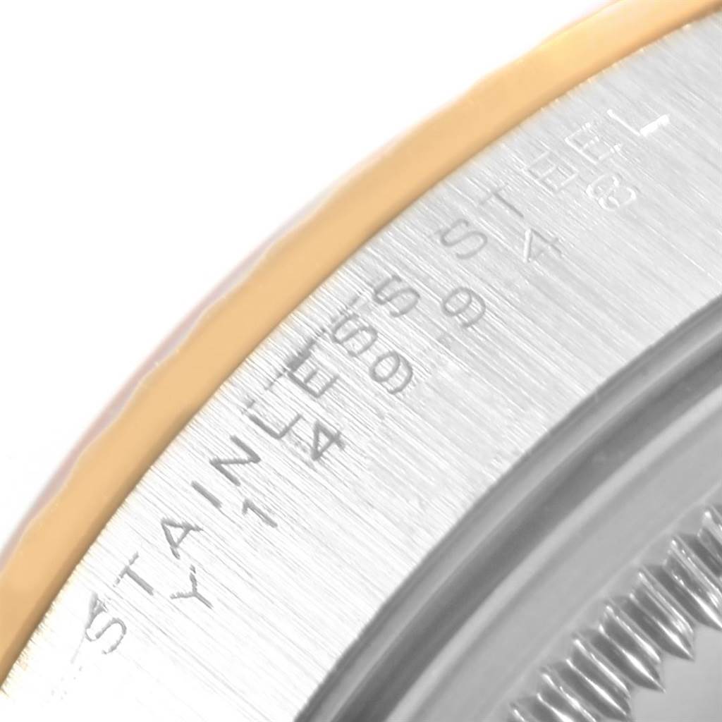 This close-up angle shows part of the stainless-steel case back of the Rolex Oyster Perpetual 14233 Men
s Steel and Gold (two tone) Grey Dial 14233 Men
s Steel and Gold (two tone) Grey Dial watch.