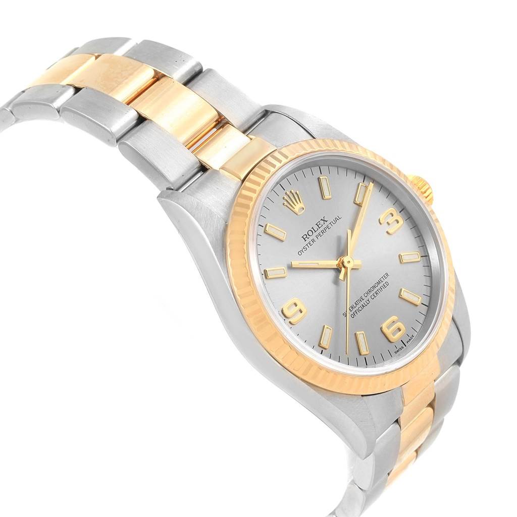 This image shows a Rolex Oyster Perpetual 14233 Men
s Steel and Gold (two tone) Grey Dial 14233 Men
s Steel and Gold (two tone) Grey Dial watch at a side angle, highlighting the bezel, dial, and bracelet.