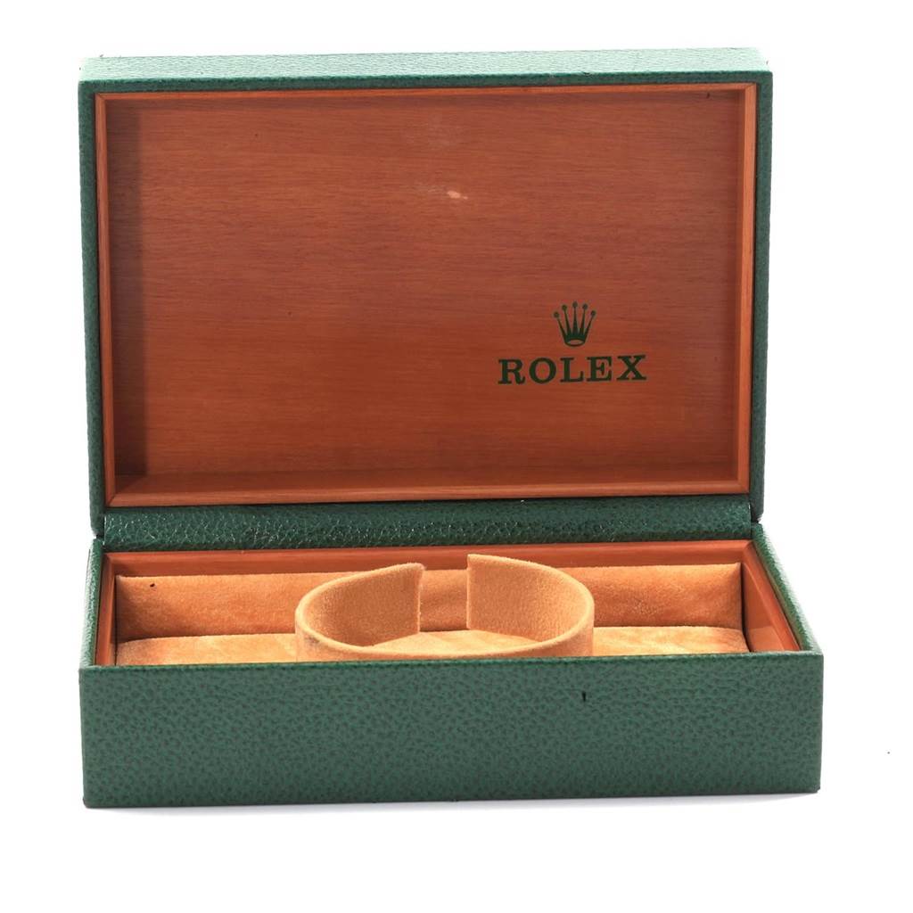 This image shows an empty Rolex Oyster Perpetual 14233 Men
s Steel and Gold (two tone) Grey Dial 14233 Men
s Steel and Gold (two tone) Grey Dial watch box, open, with a cushion for the watch inside.