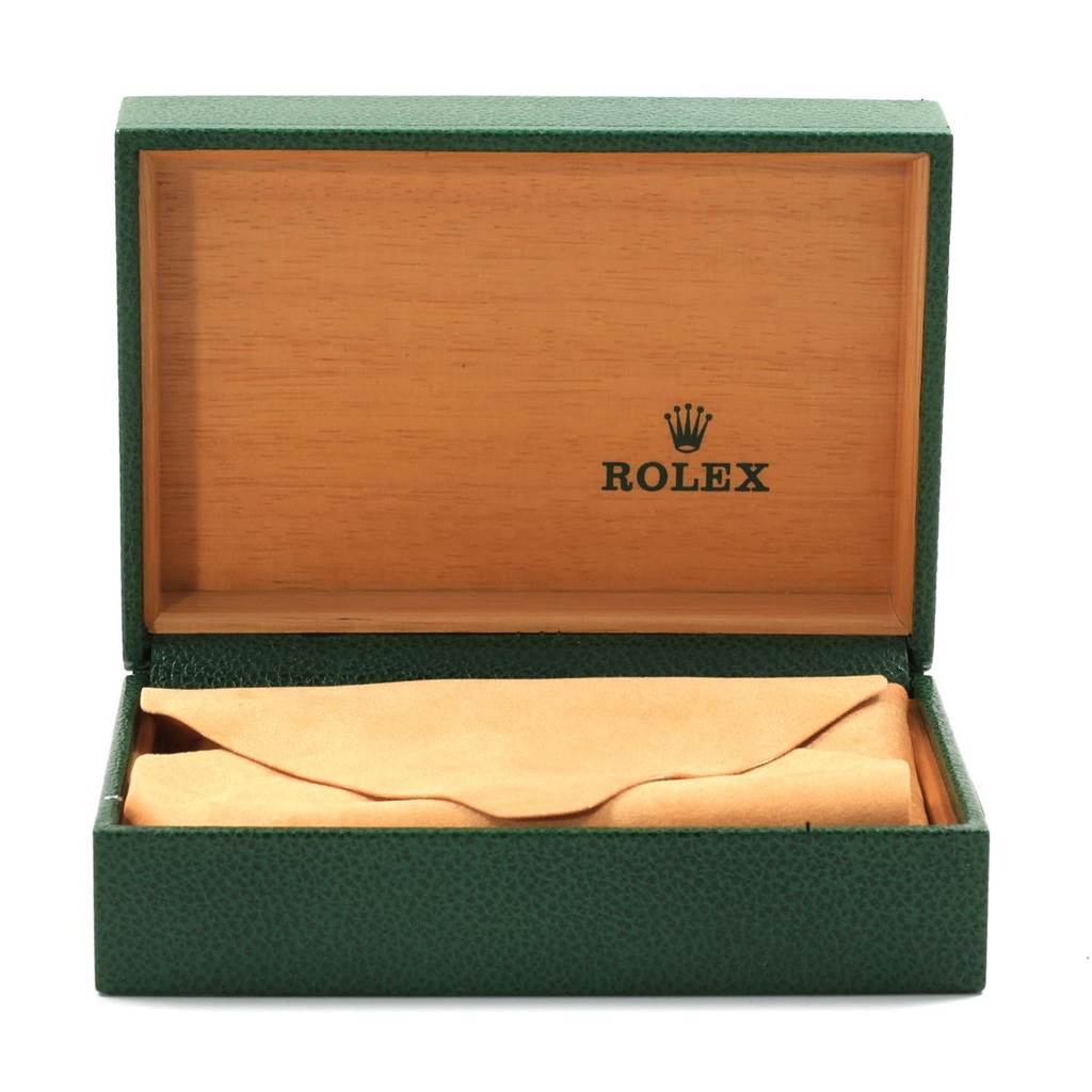 This is an open Rolex Oyster Perpetual 14233 Men's Steel and Gold (two tone) Blue Dial 14233 Men's Steel and Gold (two tone) Blue Dial watch box with a green exterior and wooden interior.
