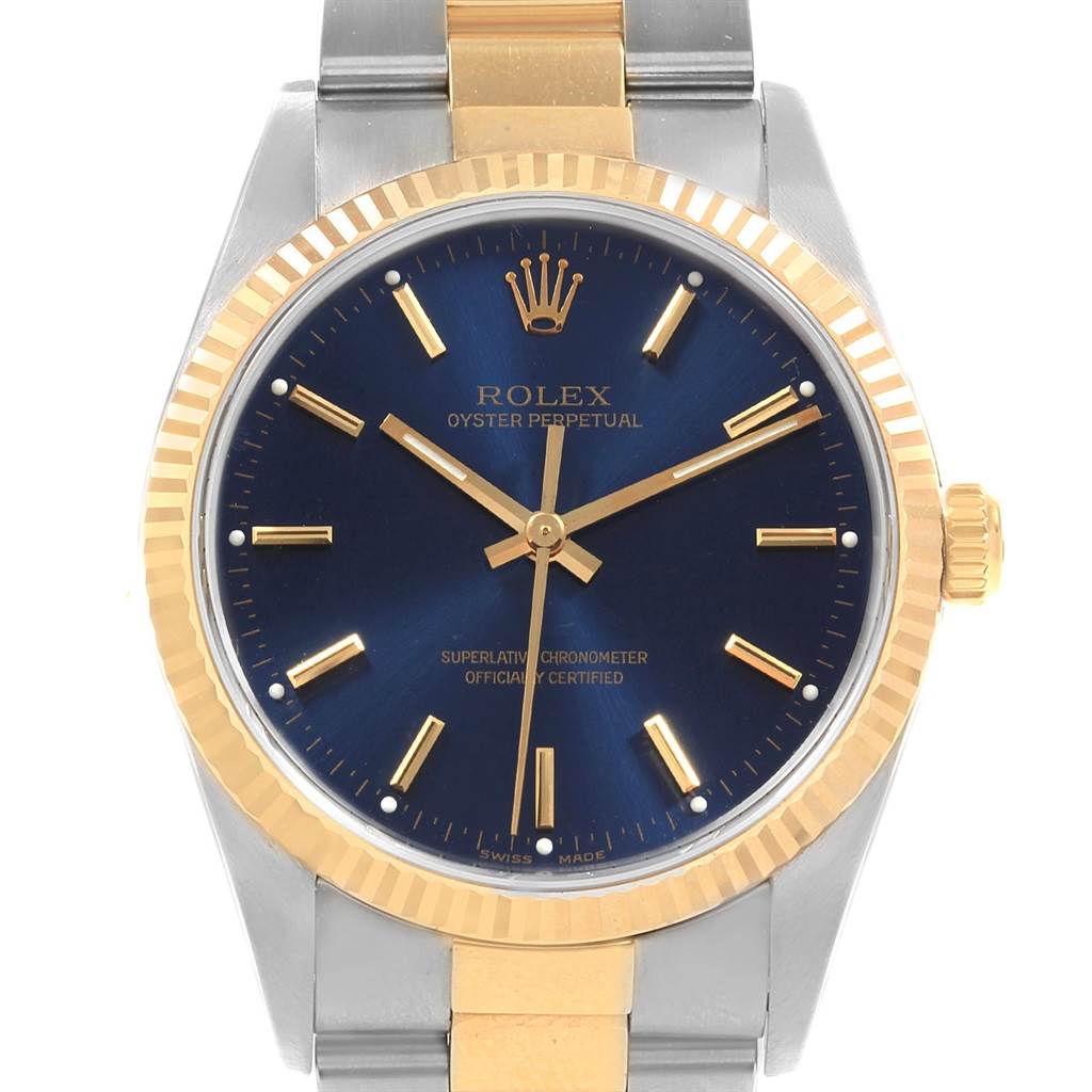 This image shows a front view of a Rolex Oyster Perpetual 14233 Men's Steel and Gold (two tone) Blue Dial 14233 Men's Steel and Gold (two tone) Blue Dial watch, highlighting the face, bezel, and partial bracelet.