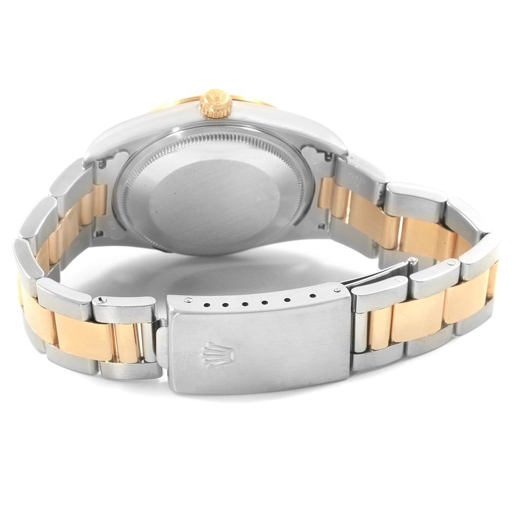 This image shows the back case and bracelet of the Rolex Oyster Perpetual 14233 Men's Steel and Gold (two tone) Blue Dial 14233 Men's Steel and Gold (two tone) Blue Dial watch.