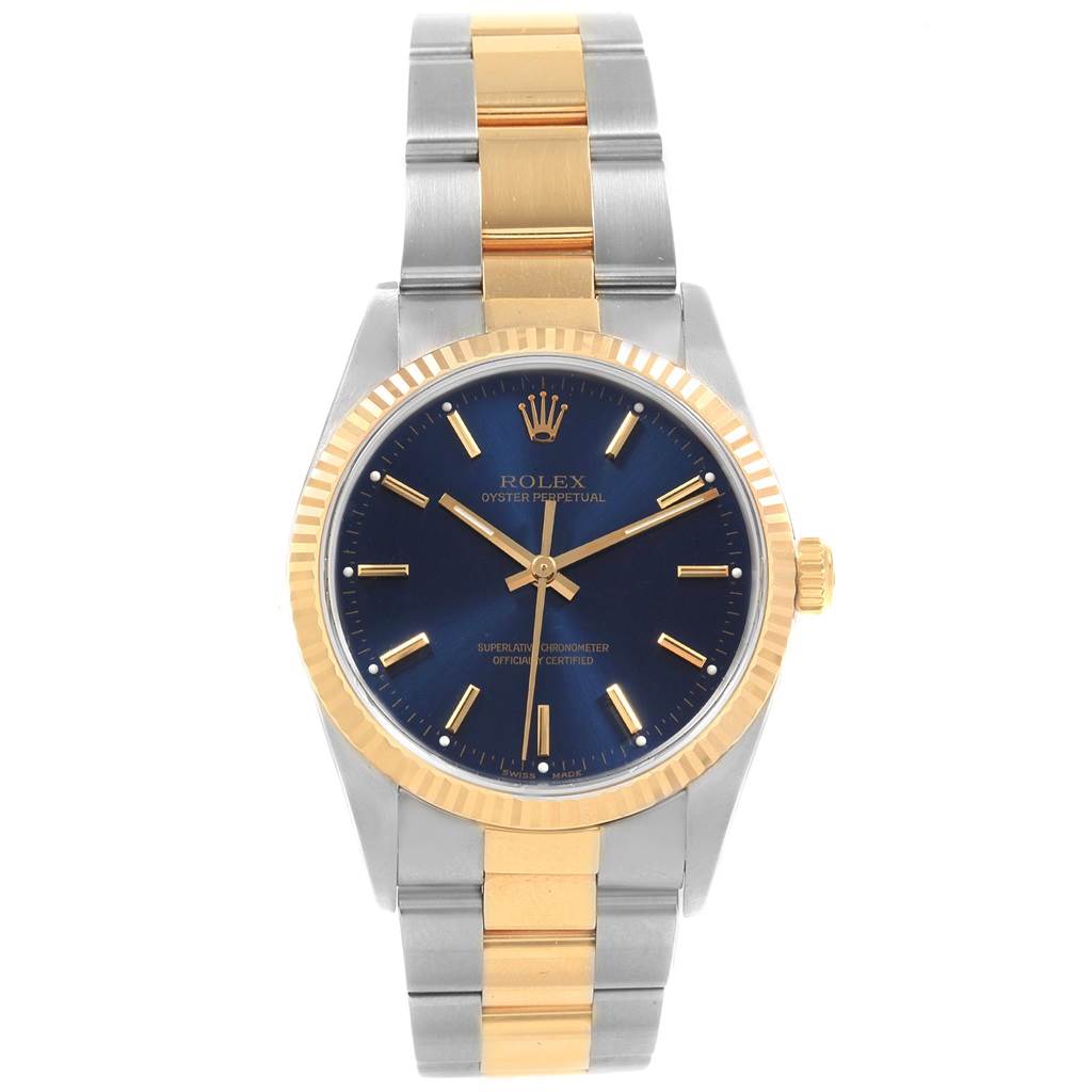 The Rolex Oyster Perpetual 14233 Men's Steel and Gold (two tone) Blue Dial 14233 Men's Steel and Gold (two tone) Blue Dial watch is shown from a front angle, displaying the face, bezel, and bracelet.