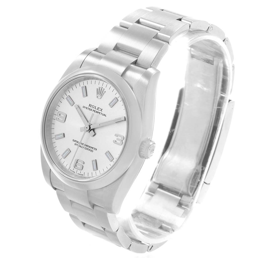 The image shows a Rolex Oyster Perpetual 114200 Men's Stainless Steel Silver Dial 114200 Men's Stainless Steel Silver Dial watch from a front-side angle, displaying the case, dial, crown, and bracelet.