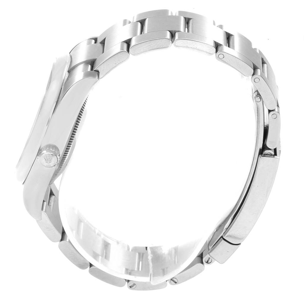 This side view of the Rolex Oyster Perpetual 114200 Men's Stainless Steel Silver Dial 114200 Men's Stainless Steel Silver Dial showcases the watch's bracelet and partially its side casing with the screw-down crown.