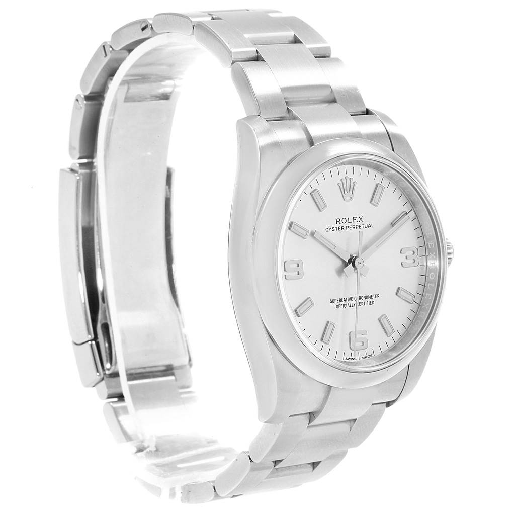 The Rolex Oyster Perpetual 114200 Men's Stainless Steel Silver Dial 114200 Men's Stainless Steel Silver Dial watch is shown at a three-quarter angle, displaying the face, bezel, and bracelet.