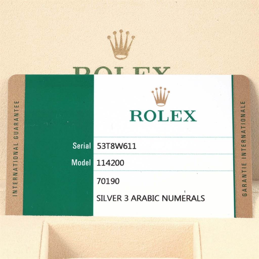 The image shows a guarantee card for a Rolex Oyster Perpetual 114200 Men's Stainless Steel Silver Dial 114200 Men's Stainless Steel Silver Dial model 114200, indicating serial number 53T8W611.