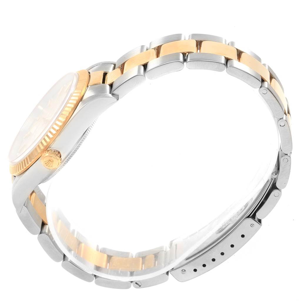 The image shows a side view of the bracelet, bezel, and crown of a Rolex Oyster Perpetual 14233 Men's Steel and Gold (two tone) Silver Dial 14233 Men's Steel and Gold (two tone) Silver Dial watch.