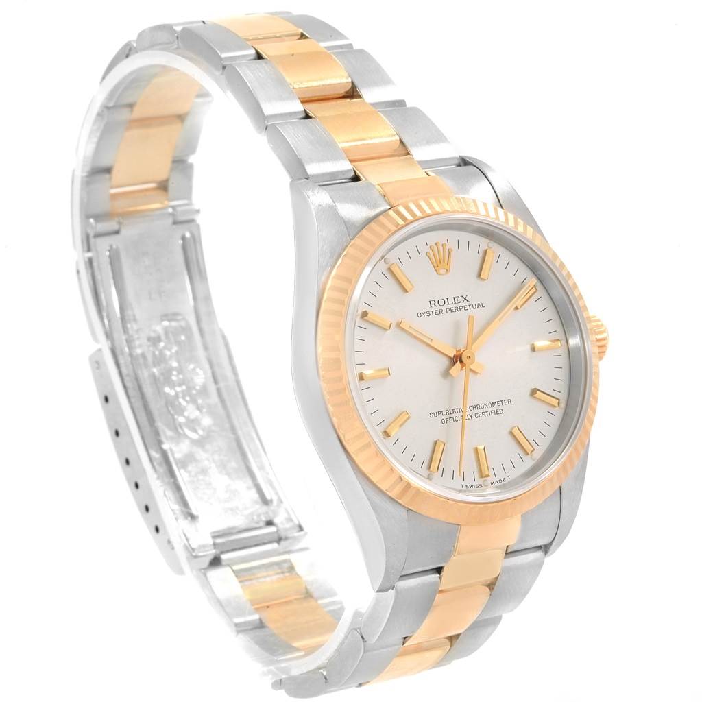 The image shows a Rolex Oyster Perpetual 14233 Men's Steel and Gold (two tone) Silver Dial 14233 Men's Steel and Gold (two tone) Silver Dial watch at an angled front view, highlighting its bezel, dial, and bracelet.