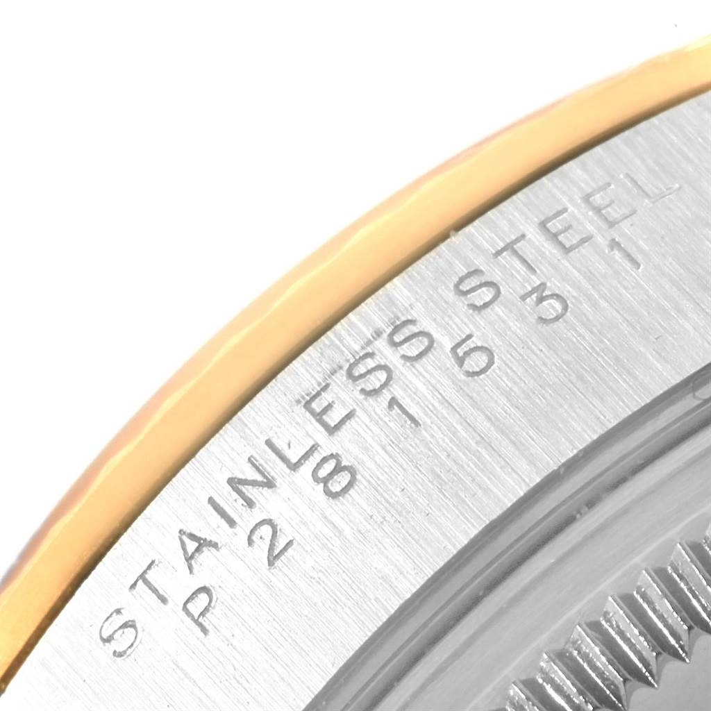 The image shows a close-up angle of the case back of a Rolex Oyster Perpetual 14233 Men's Steel and Gold (two tone) Silver Dial 14233 Men's Steel and Gold (two tone) Silver Dial, highlighting the stainless steel engraving.