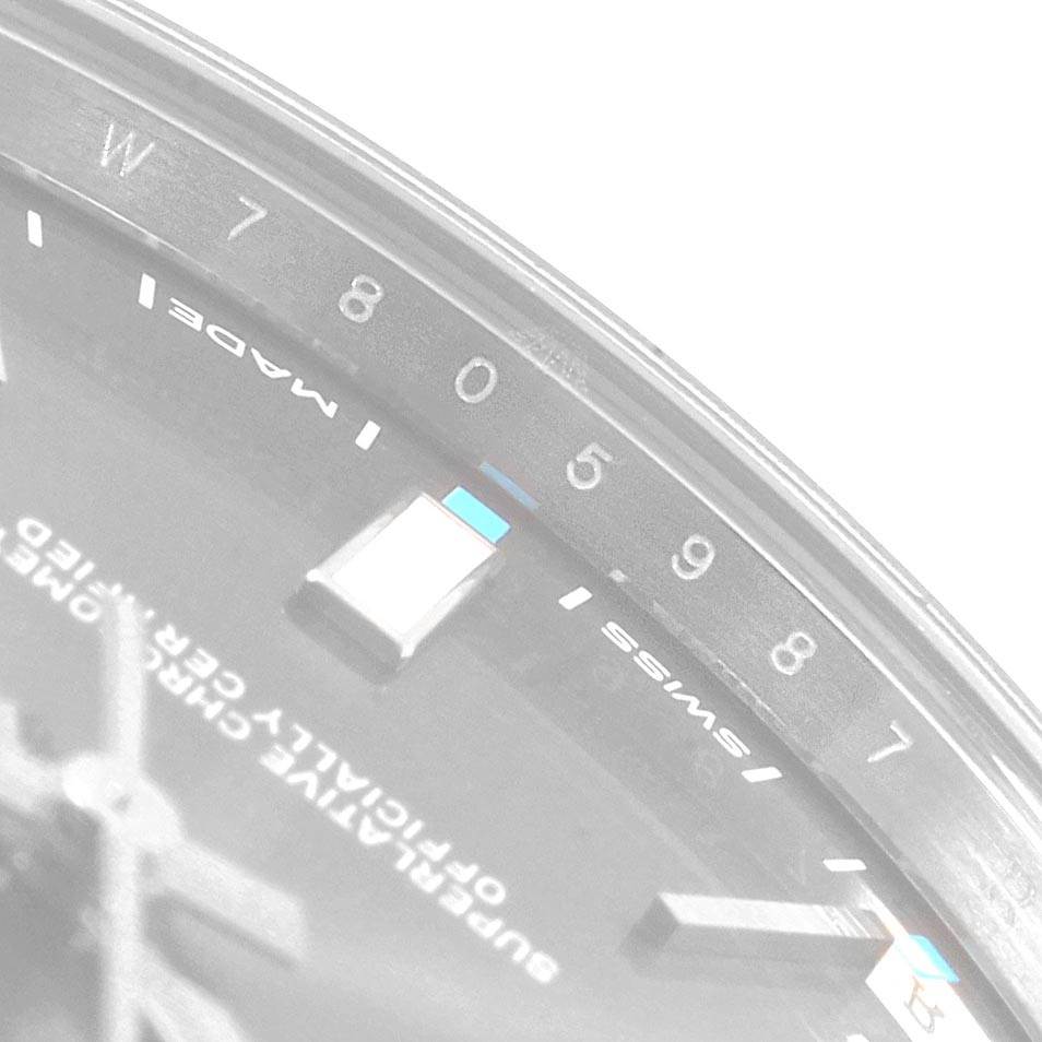 The image shows a close-up of the dial of an Oyster Perpetual Rolex watch, specifically the 5 to 8-hour markers and partial text "SWISS MADE."