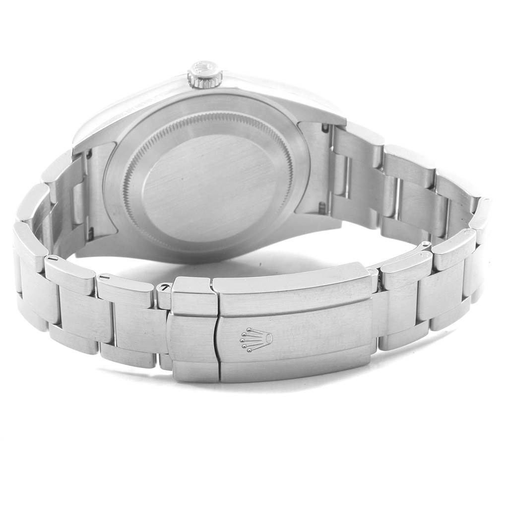 The image shows the back case and bracelet clasp of a Rolex Oyster Perpetual 114300 Men
s Stainless Steel Grey Dial 114300 Men
s Stainless Steel Grey Dial watch at a rear angle.