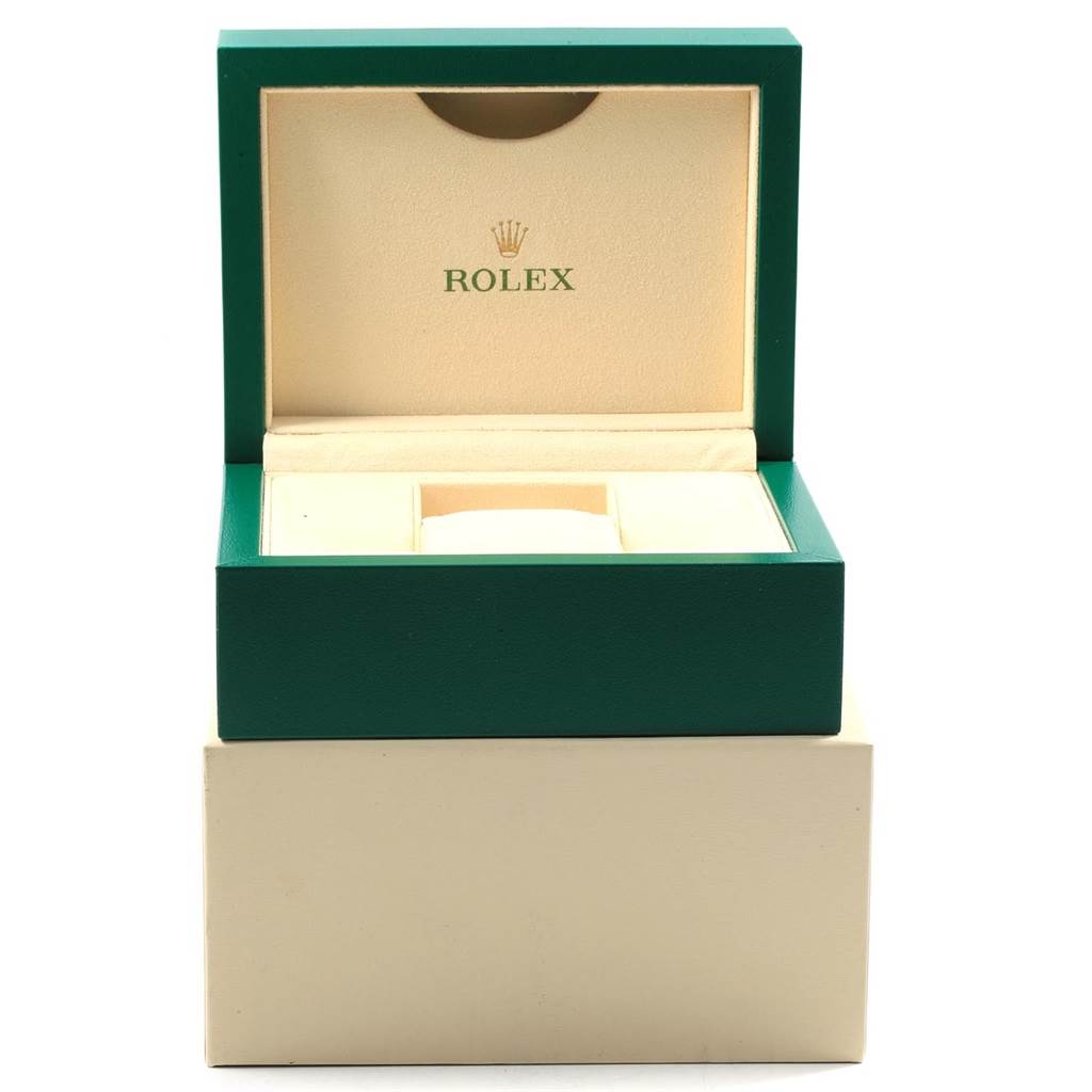 This image shows an open green Rolex watch box with the interior designed to hold an Oyster Perpetual model.