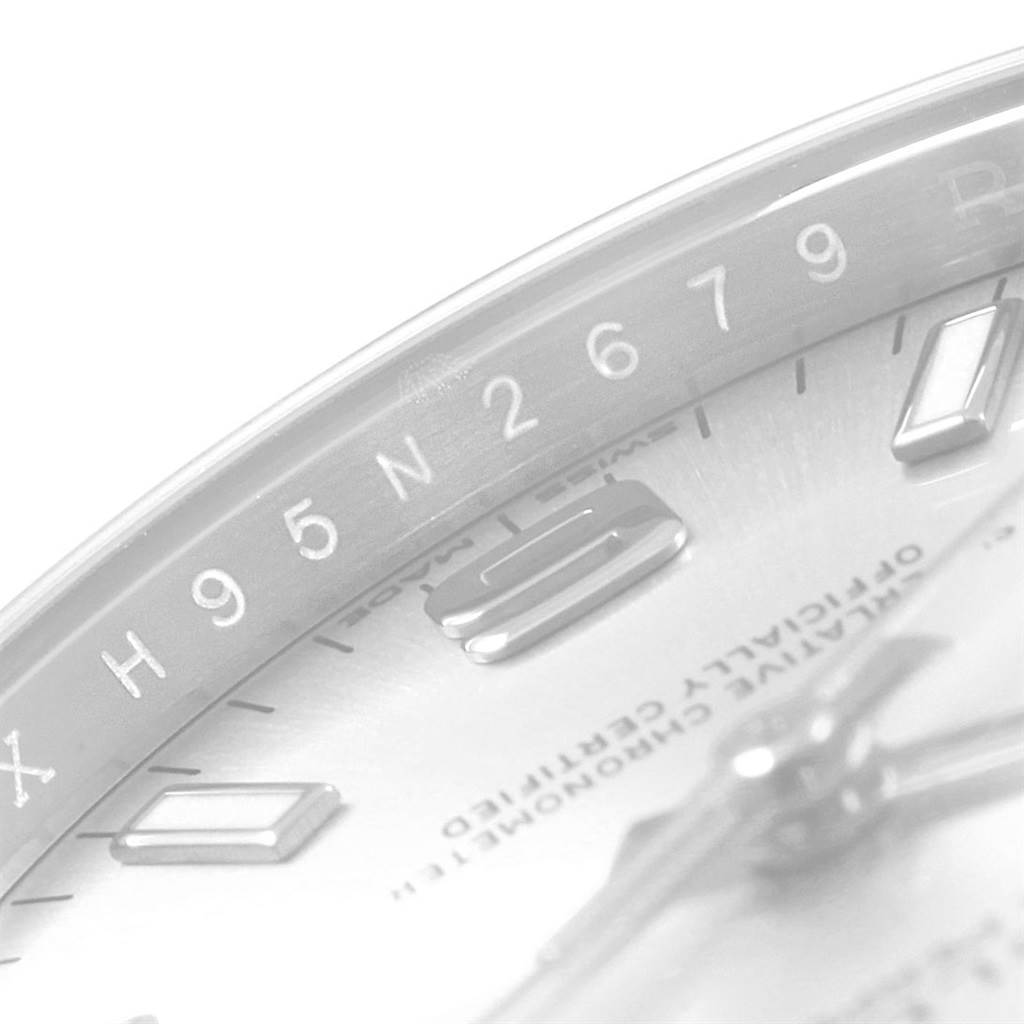 This close-up image shows a partial view of the dial and internal bezel of the Rolex Oyster Perpetual 114200 Men's Stainless Steel Silver Dial 114200 Men's Stainless Steel Silver Dial watch.