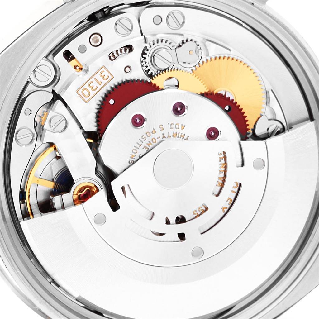 This image shows a close-up view of the movement mechanism of a Rolex Oyster Perpetual 114200 Men's Stainless Steel Silver Dial 114200 Men's Stainless Steel Silver Dial watch.