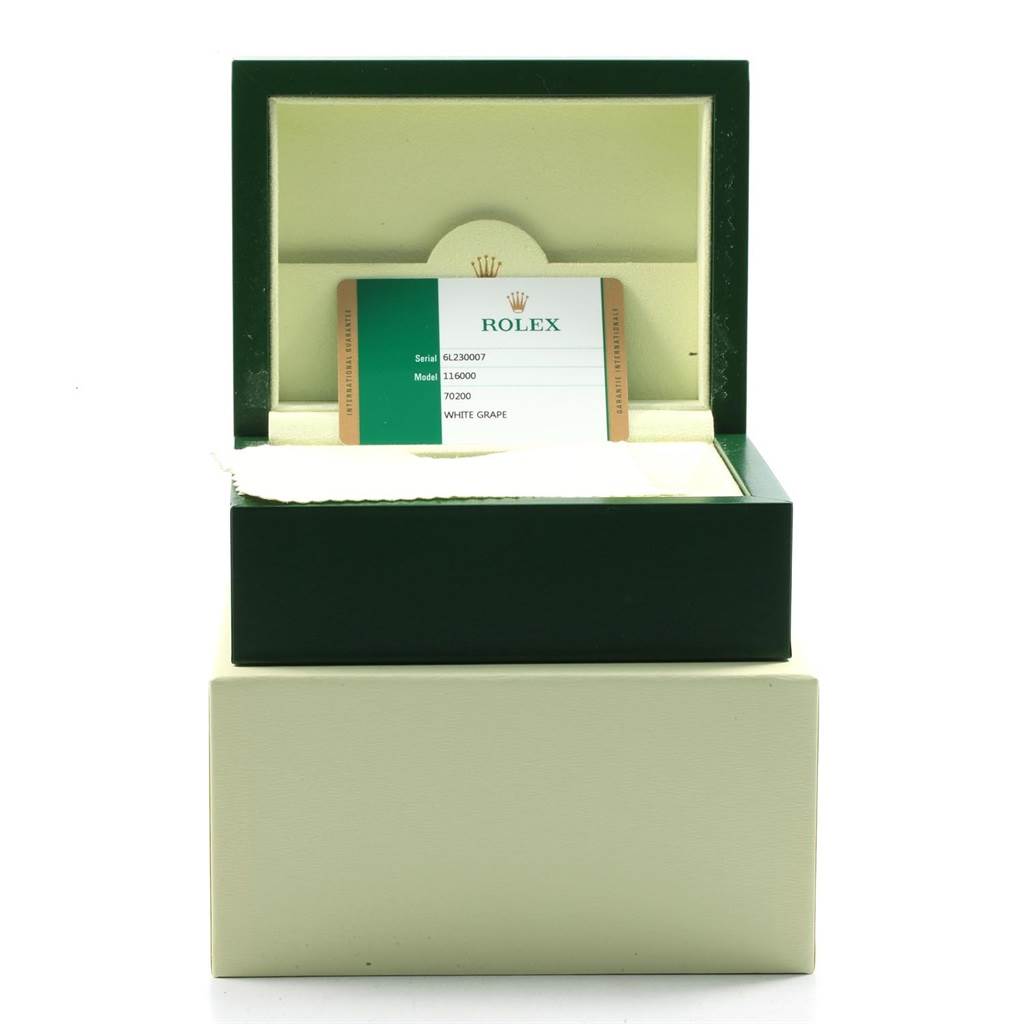 The image shows a Rolex box with an Oyster Perpetual model warranty card inside.