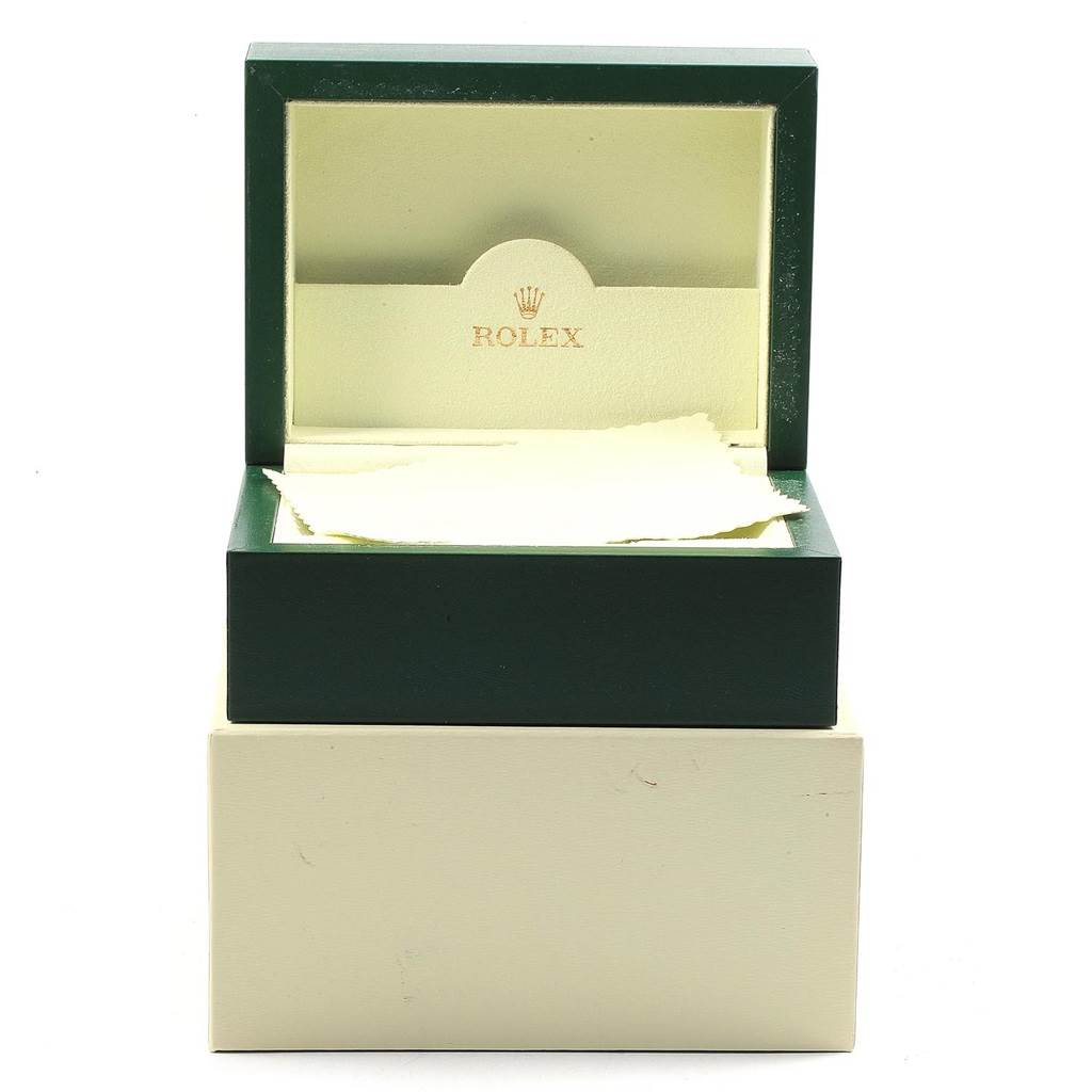 The image shows an open box for the Rolex Oyster Perpetual 114200 Stainless Steel Green Dial 114200 Stainless Steel Green Dial model, displaying the interior packaging from a front angle.