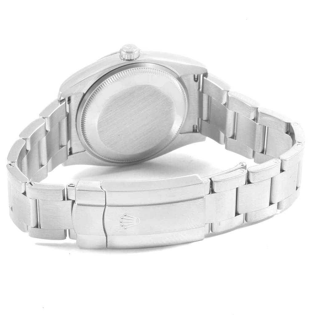 This image shows the back case and clasp of the Rolex Oyster Perpetual 114200 Stainless Steel Green Dial 114200 Stainless Steel Green Dial watch, viewed from a rear angle.