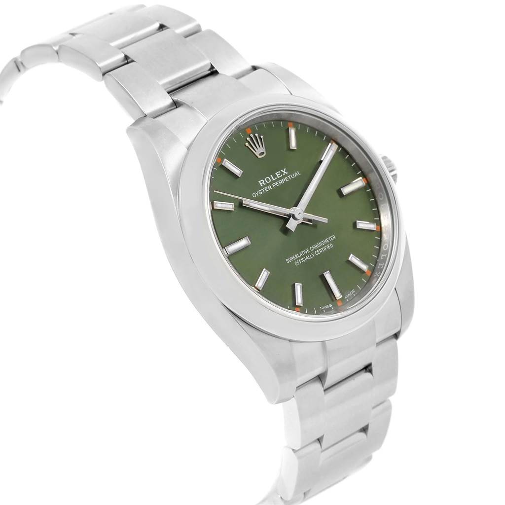 The image shows a side angle view of a Rolex Oyster Perpetual 114200 Men
s Stainless Steel Green Dial 114200 Men
s Stainless Steel Green Dial watch, highlighting its green dial, case, and metal bracelet.