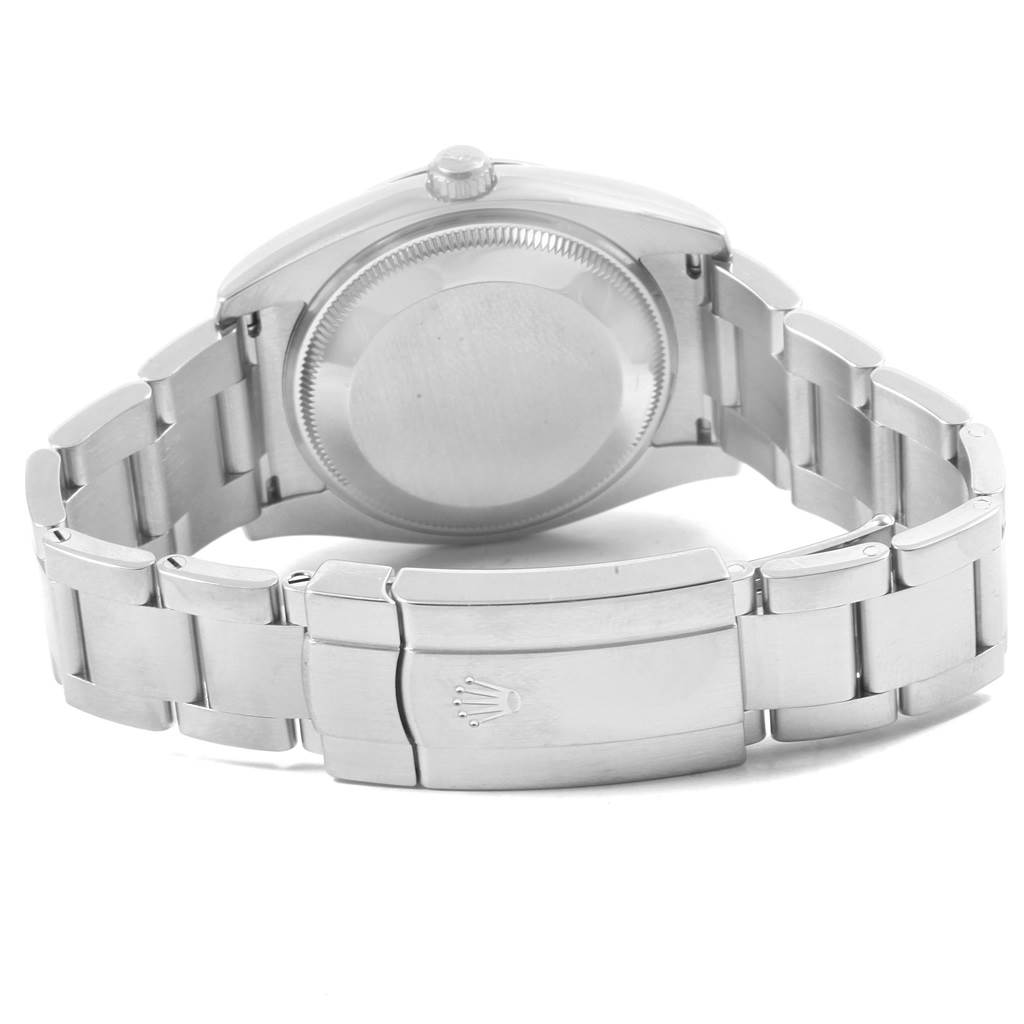 The image shows the back view of a Rolex Oyster Perpetual 114200 Men
s Stainless Steel Green Dial 114200 Men
s Stainless Steel Green Dial watch, displaying the case back and the bracelet with the clasp.