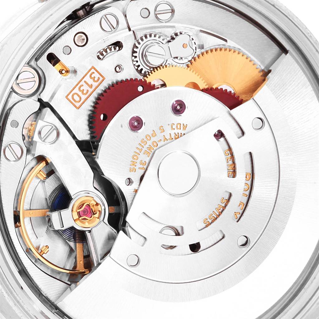 The image shows a close-up view of the movement mechanism of a Rolex Oyster Perpetual 114200 Men
s Stainless Steel Green Dial 114200 Men
s Stainless Steel Green Dial watch.