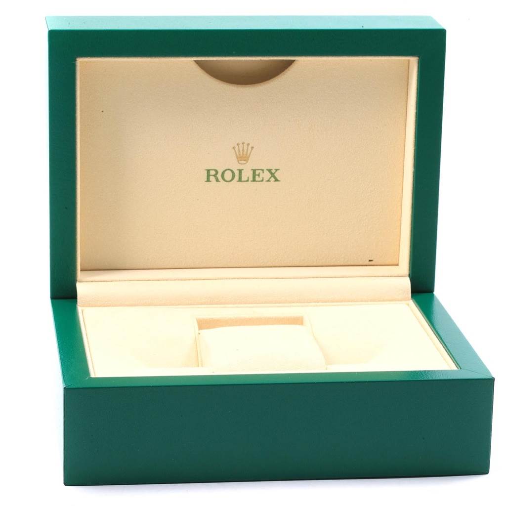 This image shows an open Rolex Oyster Perpetual 114200 Men
s Stainless Steel Green Dial 114200 Men
s Stainless Steel Green Dial watch box with a green exterior and beige interior.