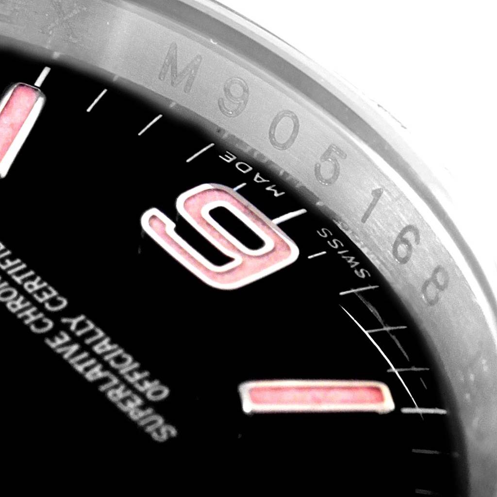 The image shows a close-up of the dial and rehaut of a Rolex Oyster Perpetual 116000 Men's Stainless Steel Black Dial 116000 Men's Stainless Steel Black Dial watch, highlighting the number “9” and "SWISS MADE" text.
