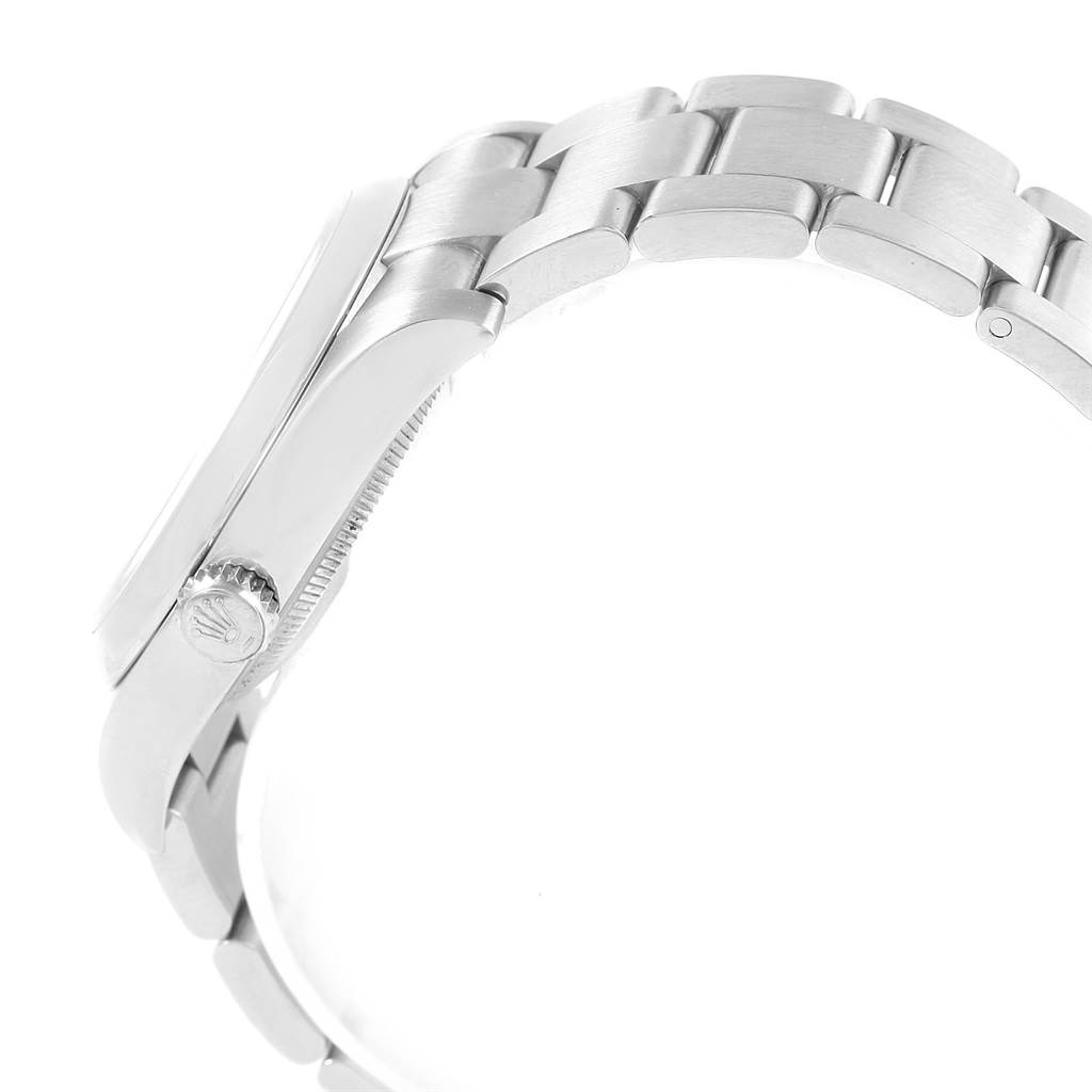 This side view of the Rolex Oyster Perpetual 116000 Men's Stainless Steel Black Dial 116000 Men's Stainless Steel Black Dial watch shows the bracelet, crown, and part of the case.