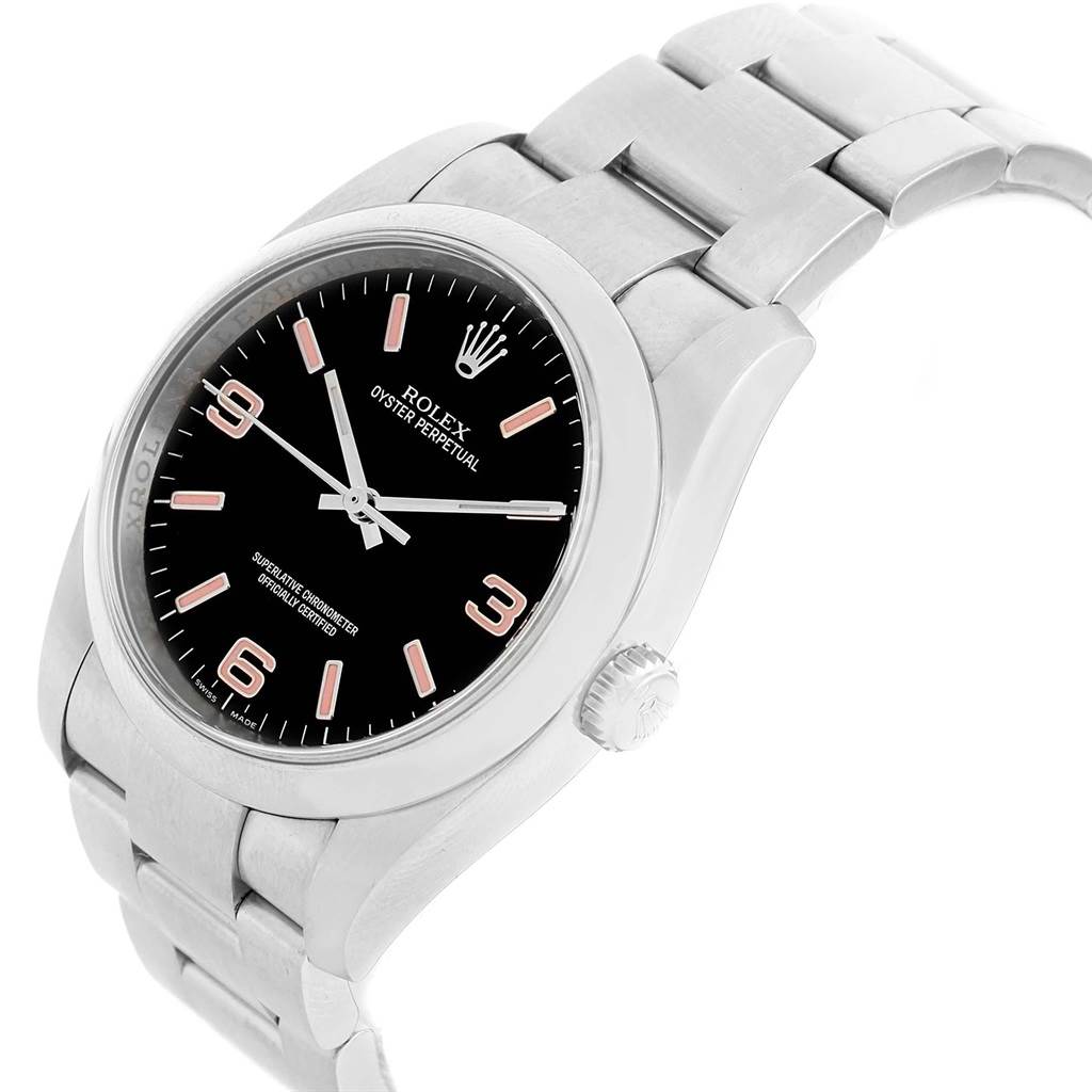 The image shows a Rolex Oyster Perpetual 116000 Men's Stainless Steel Black Dial 116000 Men's Stainless Steel Black Dial watch from a 3/4 angle highlighting its face, bezel, and part of the bracelet.
