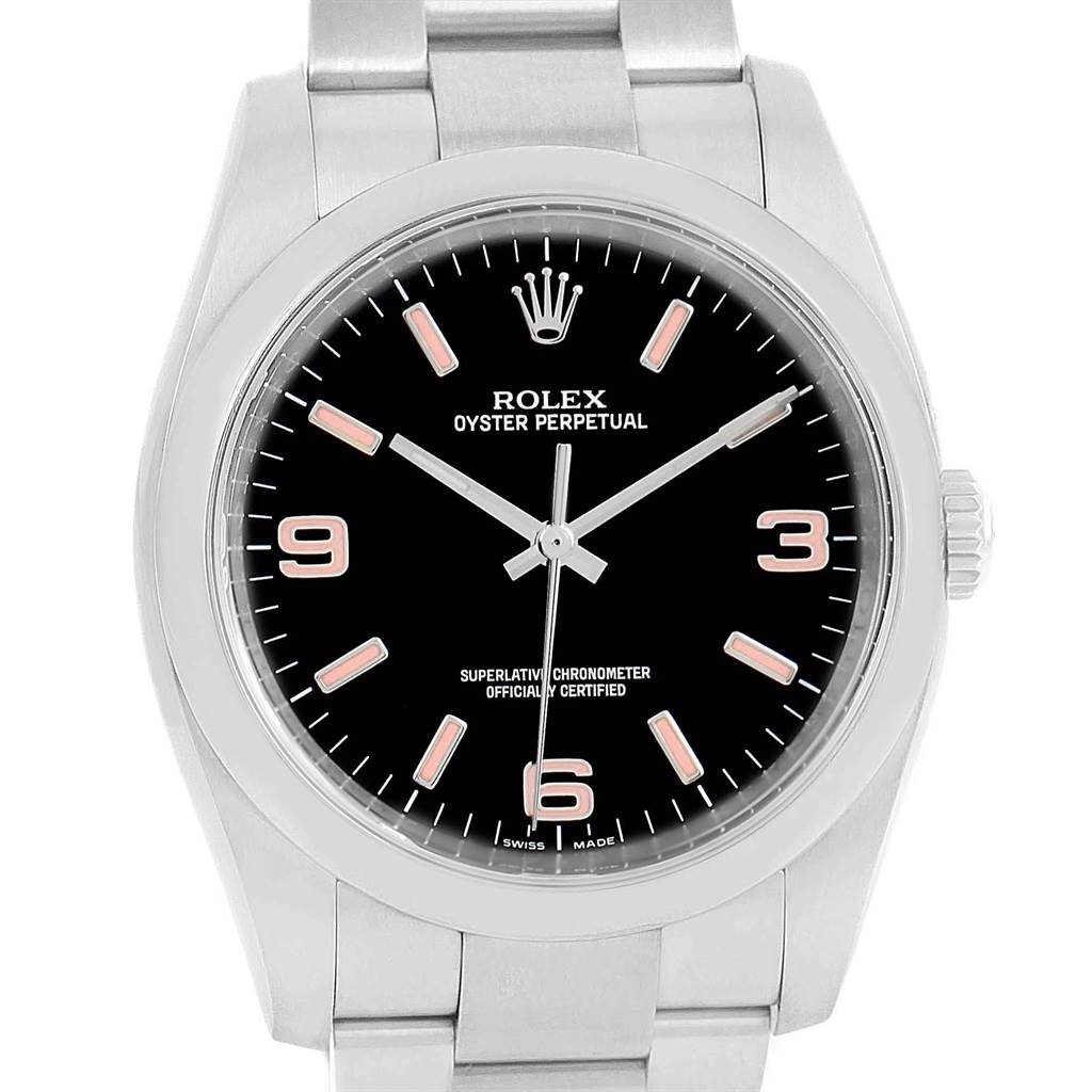 The image shows a front view of the Rolex Oyster Perpetual 116000 Men's Stainless Steel Black Dial 116000 Men's Stainless Steel Black Dial watch, detailing its black dial, numeral markers, and metal bracelet.