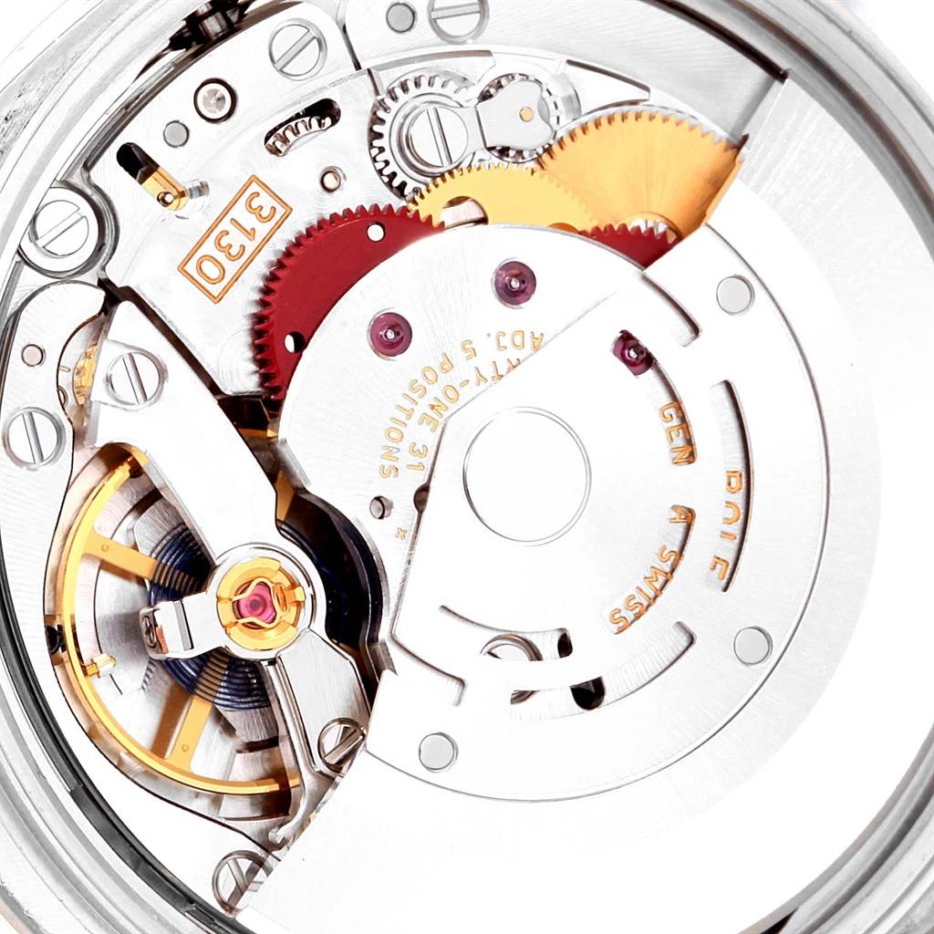 This close-up image shows the intricate inner mechanisms and gears of the Rolex Oyster Perpetual 114200 Stainless Steel Burgundy Dial 114200 Stainless Steel Burgundy Dial watch model.