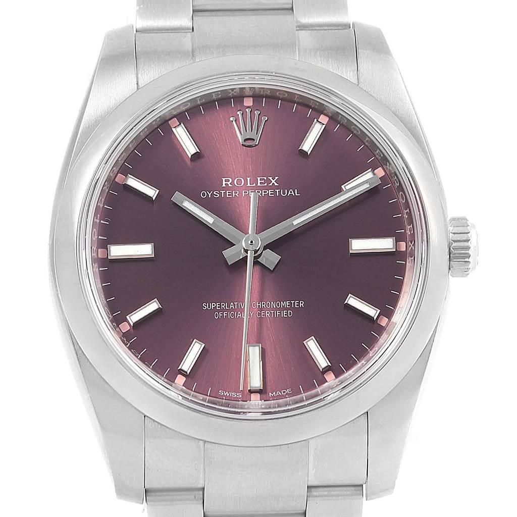 This image shows a Rolex Oyster Perpetual 114200 Stainless Steel Burgundy Dial 114200 Stainless Steel Burgundy Dial watch from a front angle, highlighting its dial, hands, indices, bezel, and part of the bracelet.