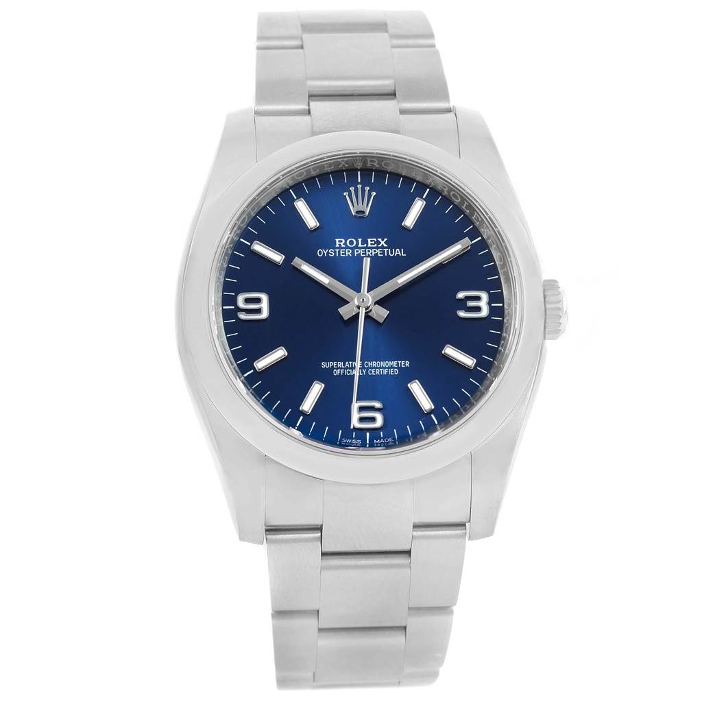 The image shows a front view of a Rolex Oyster Perpetual 116000 Men's Stainless Steel Blue Dial 116000 Men's Stainless Steel Blue Dial watch with a blue dial and stainless steel bracelet.