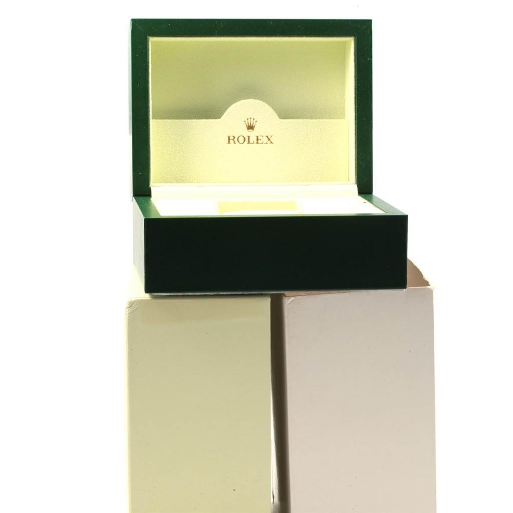 The image shows an open box for a Rolex Oyster Perpetual 116000 Men's Stainless Steel Blue Dial 116000 Men's Stainless Steel Blue Dial watch, displaying the brand's logo on the interior lid.