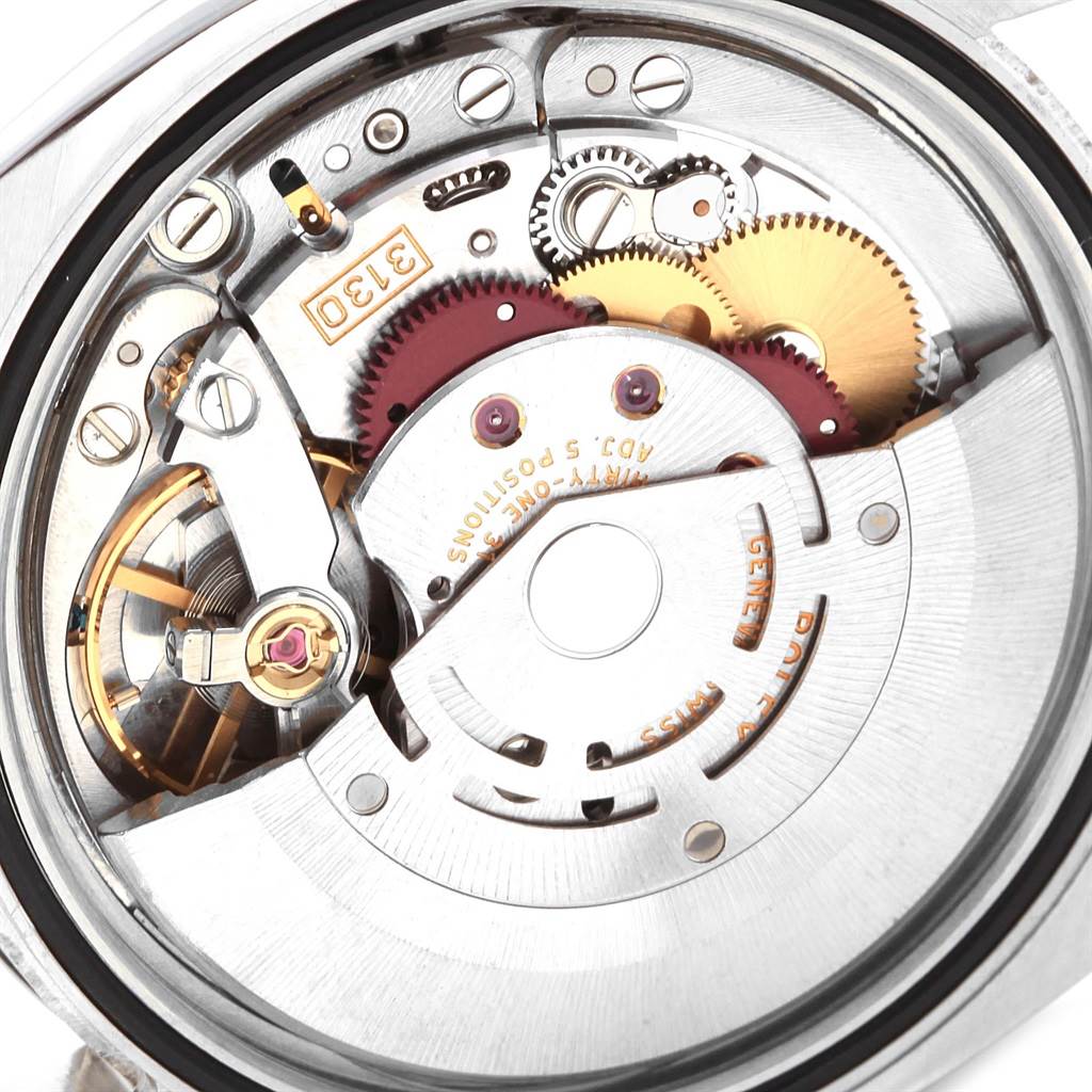 This image shows the internal mechanism of the Rolex Oyster Perpetual 116000 Men's Stainless Steel Blue Dial 116000 Men's Stainless Steel Blue Dial watch, highlighting gears and detailed components.