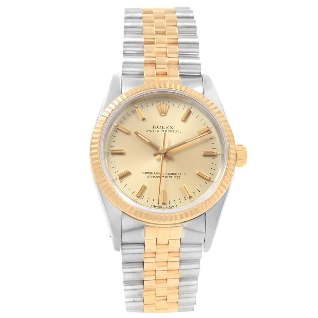 The image shows a frontal view of a Rolex Oyster Perpetual 14233 Men's Steel and Gold (two tone) Champagne Dial 14233 Men's Steel and Gold (two tone) Champagne Dial watch with a two-tone bracelet and gold bezel.
