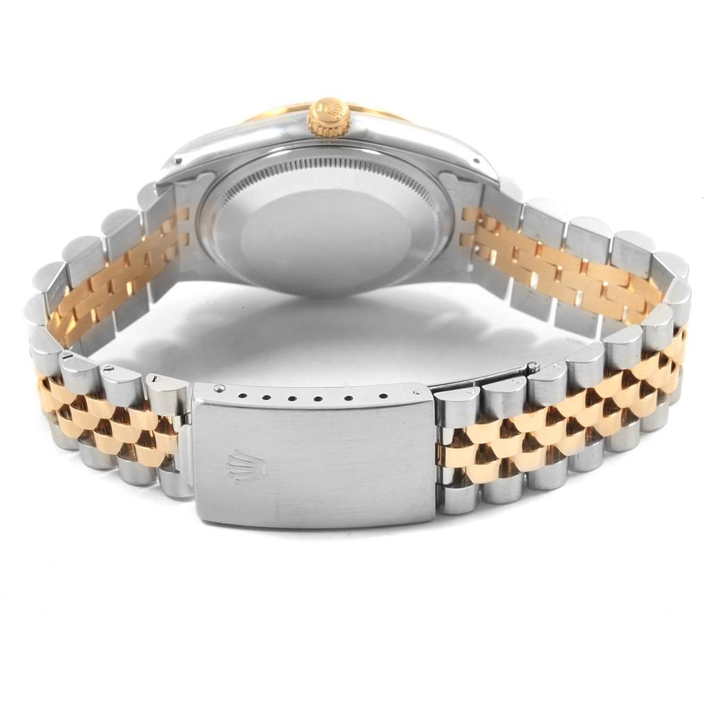 This image shows the back view of a Rolex Oyster Perpetual 14233 Men's Steel and Gold (two tone) Champagne Dial 14233 Men's Steel and Gold (two tone) Champagne Dial watch, highlighting its bracelet and clasp.